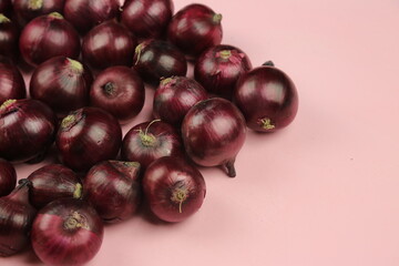 sweet red onions on background