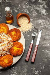 top view tasty fried cutlets with cooked rice on dark background meal photo meat