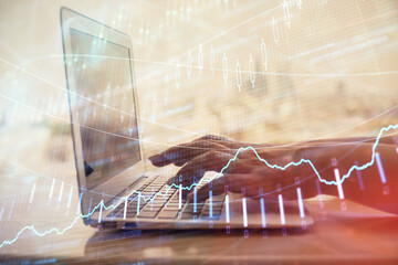 Double exposure of woman hands typing on computer and forex chart hologram drawing. Stock market invest concept.