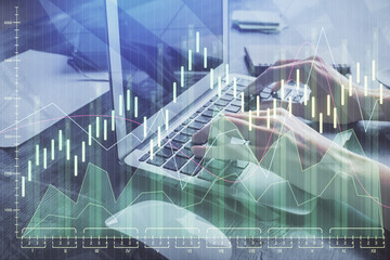 Double exposure of woman hands typing on computer and forex chart hologram drawing. Stock market invest concept.