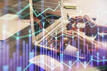 Double exposure of woman hands typing on computer and forex chart hologram drawing. Stock market invest concept.
