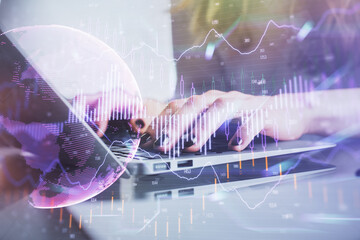 Double exposure of woman hands typing on computer and forex chart hologram drawing. Stock market invest concept.