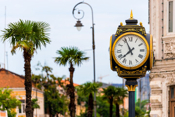 Fototapeta na wymiar Old Street Clock In Europe. Architecture Element In The Main Square In Batumi.