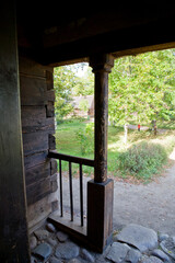  view from the historic wooden porch to the green backyard