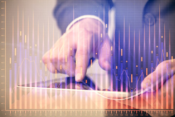 Multi exposure of man's hands holding and using a phone and financial chart drawing. Market analysis concept.