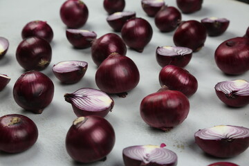 sweet red onions on background