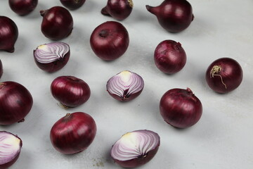 sweet red onions on background