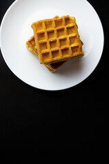 waffles on a white plate close up
