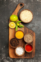 top view raw rice with lemons and seasonings on dark background spice fruit raw food