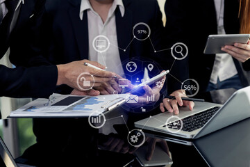 Technology and financial advisory services concert. Business teamwork and working on digital laptop computer with advisor showing plan of investment to clients at table office. Digital marketing.