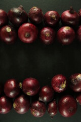 sweet red onions on background