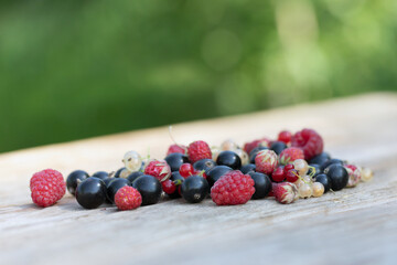 Berries on wooden table background. Summer organic fruit berry. Selective focus