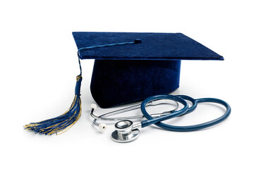 Fototapeta medical education - college graduation cap and stethoscope isolated on white background obraz