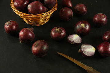 sweet red onions on background