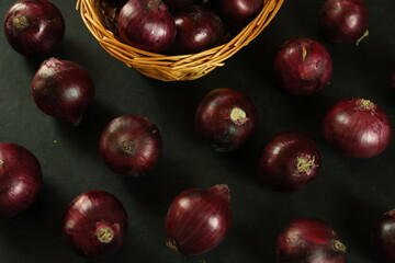 sweet red onions on background