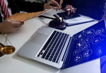 Concepts of Law and Legal services. lawyer business working on digital tablet and law interface icons.	