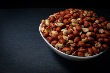 Heaps of peanuts on a plate