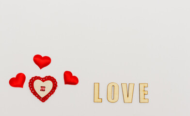 Inscription love and red hearts on white background. Romantic Valentines day background, i love you...