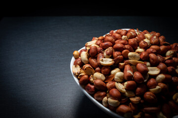 Heaps of peanuts on a plate