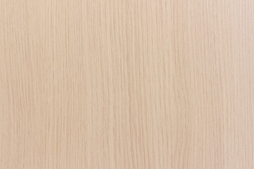 The surface of a light beige wood board.