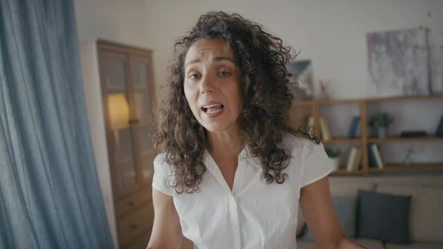 Pov of exhausted young woman arguing and gesturing emotionally having dispute with partner slapping him in face while fighting