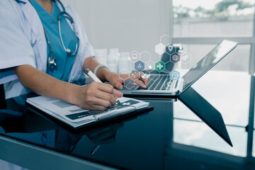 doctor working on a laptop