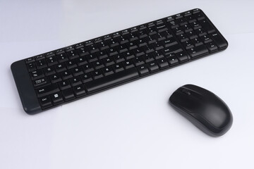 black mouse and keyboard with isolated white background. technology products with an office concept suitable for design and other materials