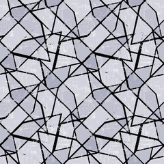 Seamless abstract geometric pattern. Dark gray shapes on a light background.