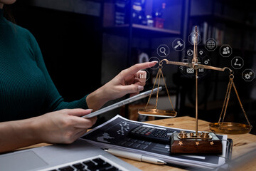 Concepts of Law and Legal services.	lawyer woman working with law interface icons on table office.