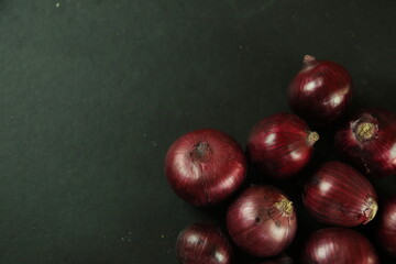 sweet red onions on background