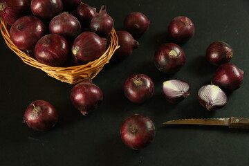 sweet red onions on background