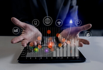Double exposure of businesswoman hand touching on tablet with business financial virtual chart, Digital marketing concept. 