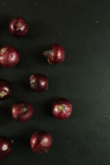 sweet red onions on background