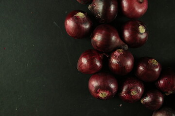 sweet red onions on background