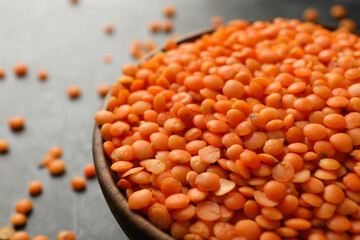 Wooden bowl with red legumes, close up