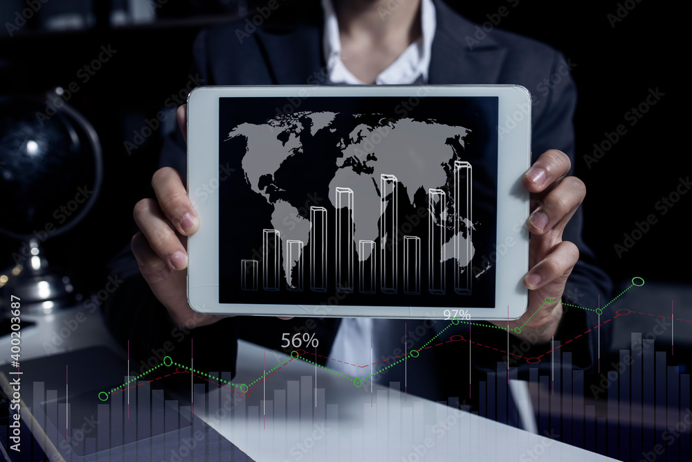 Poster business hand using tablet and showing a growing virtual hologram of statistics graph chart, finance