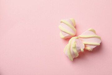 Fototapeta na wymiar Sweet marshmallow on pink background, space for text