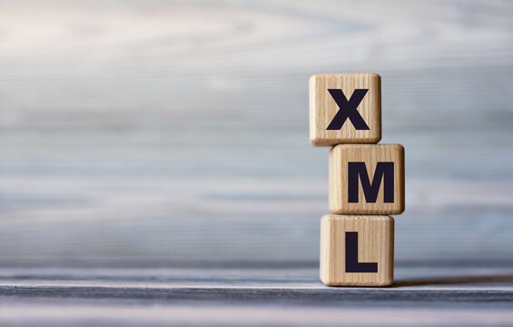 XML - word on wooden cubes against the background of a light board with beautiful divorces