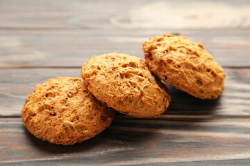 Oats biscuits on a brown background with copy space