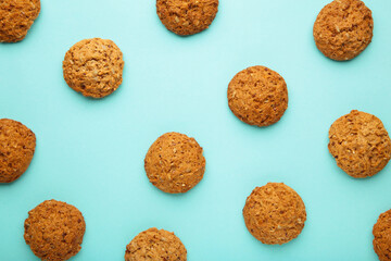 Many oats biscuits on a blue background