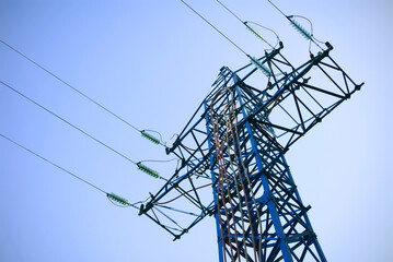 High voltage electricity pole view from the bottom. 