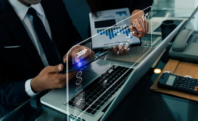 Double exposure of businessman working on digital tablet and laptop computer with digital marketing virtual chart, Abstract icon, Business strategy and technology concept.