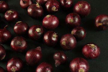 sweet red onions on background