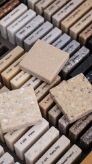 Decorative artificial stone in samples. Suitcase with samples of artificial stone. Finishing material, interior renovation. Gomel / Belarus / 18.12.2020 year