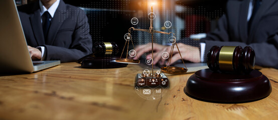 Concepts of Law and Legal services.	Lawyer business hands working with law interface icons at table office. technology and lawyer. 