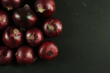sweet red onions on background