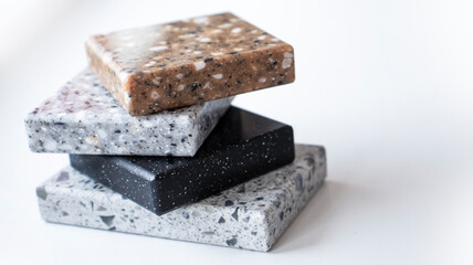 Decorative artificial stone in samples. Suitcase with samples of artificial stone. Finishing material, interior renovation.