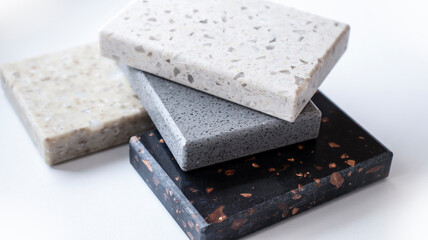 Decorative artificial stone in samples. Suitcase with samples of artificial stone. Finishing material, interior renovation.