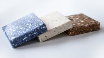 Decorative artificial stone in samples. Suitcase with samples of artificial stone. Finishing material, interior renovation.