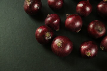 sweet red onions on background